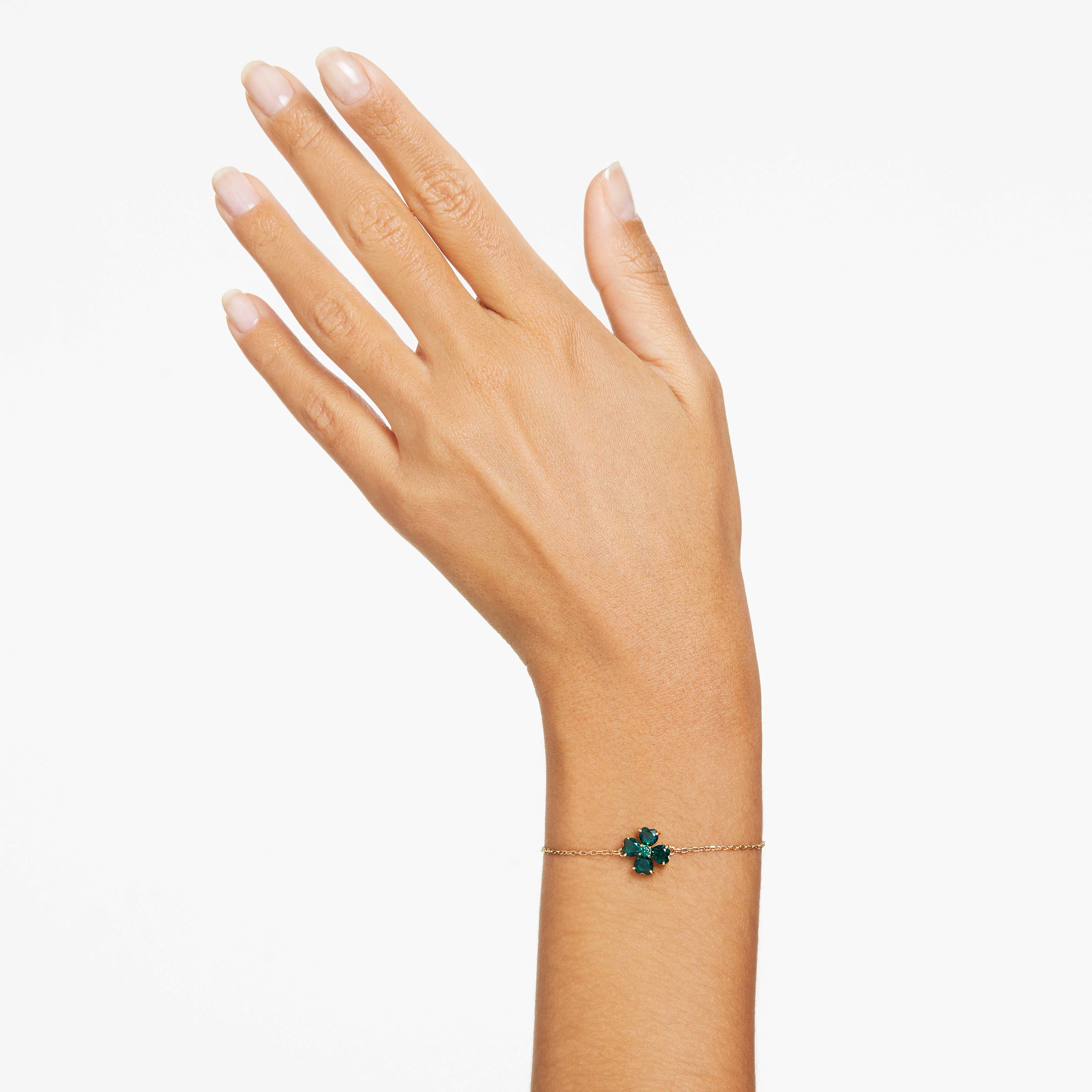 swarovski سوار idyllia، قطع متنوع، على شكل زهرة برسيم، لون أخضر، طلاء بلون ذهبي